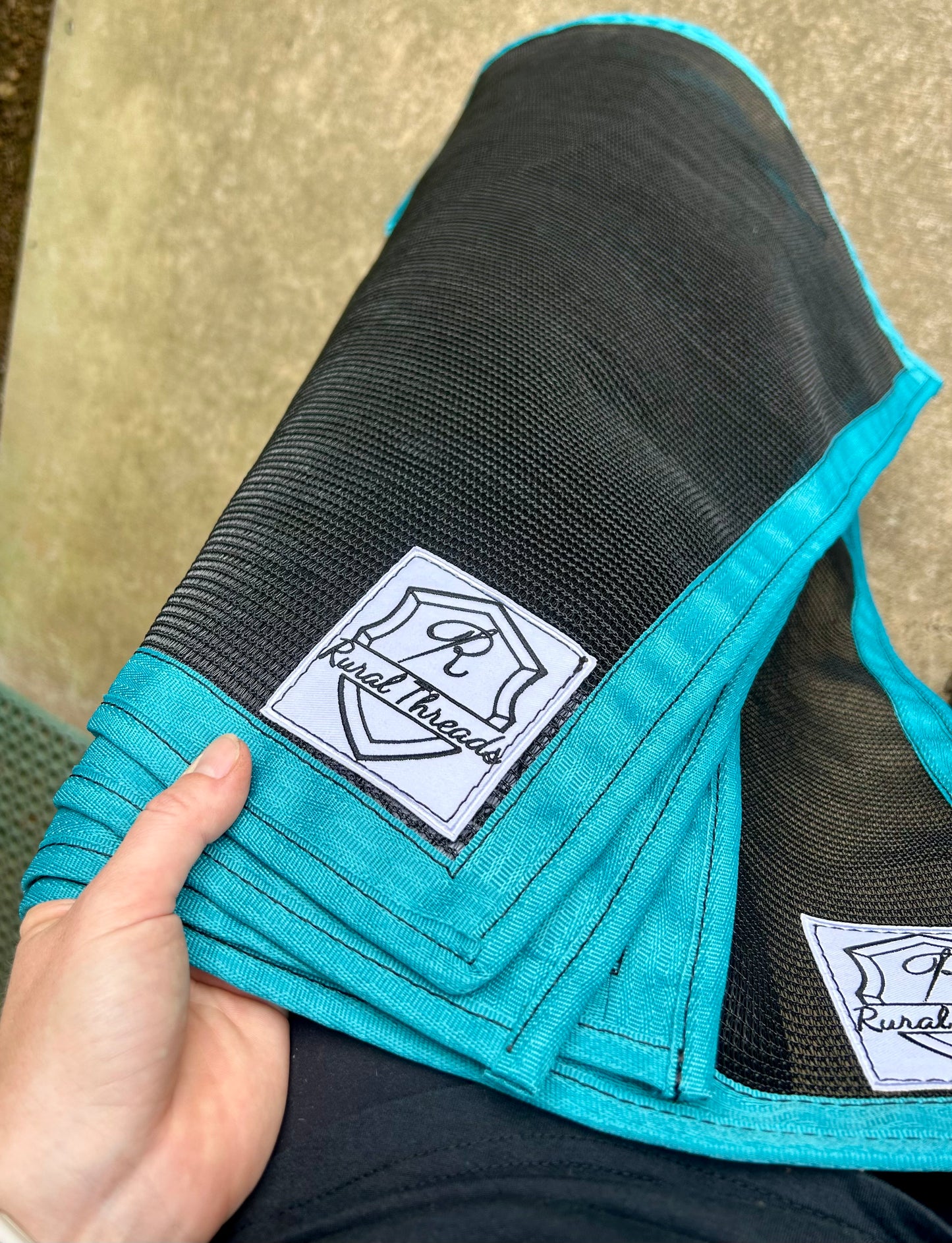 Black cloth with Teal binding 