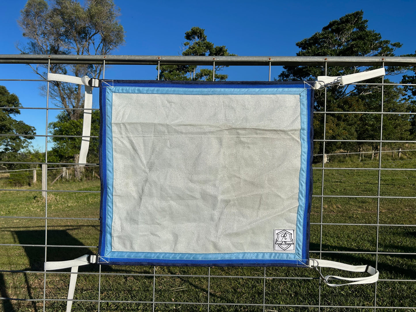 White cloth with Sky Blue, Royal Blue and Black binding 
