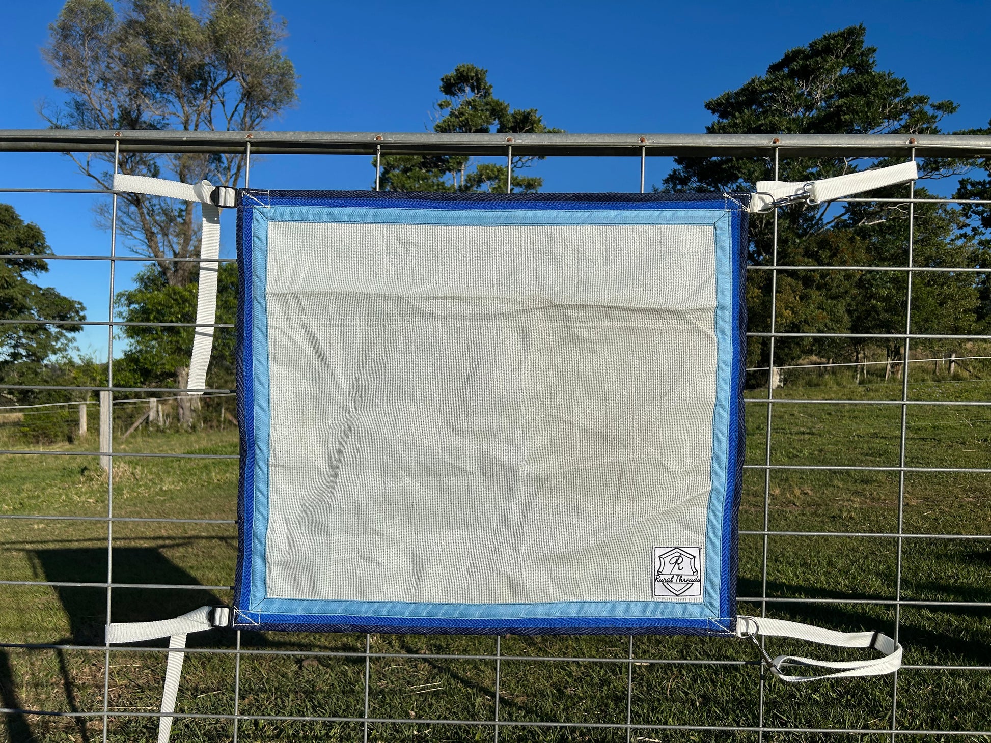 White cloth with Sky Blue, Royal Blue and Black binding 